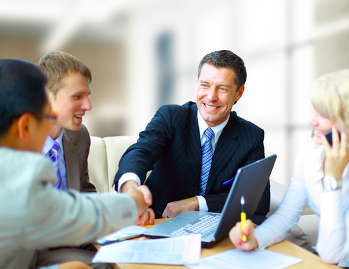 Business people shaking hands, finishing up a meeting